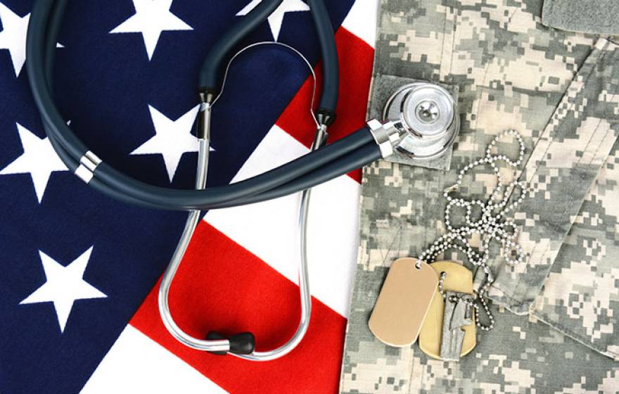 photo illustration: US flag, military fatigues, dog tags, stethoscope