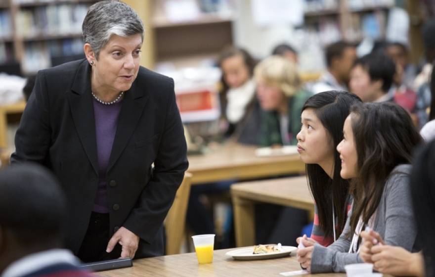 President Napolitano speaking to two students at Oakland Tech