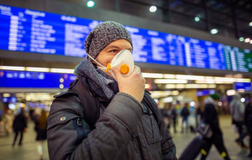 Man with a mask in an airport