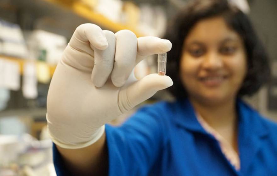 Amrita Banerjee holds capsule