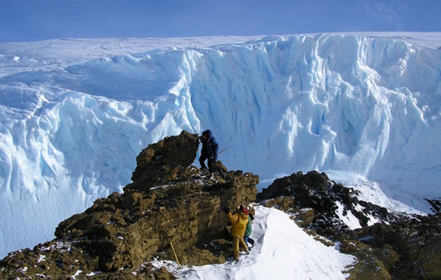 climbing rocks for samples - Antarctica