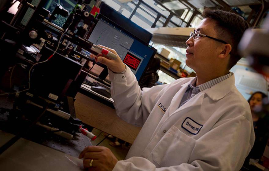 Nanoengineering professor Shaochen Chen 3D prints a biomimetic blood vessel network.