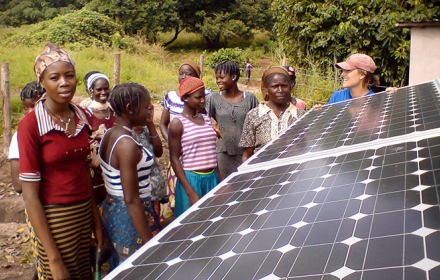 Jennifer Burney with solar panels