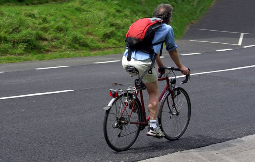 middle-aged man riding bicycle