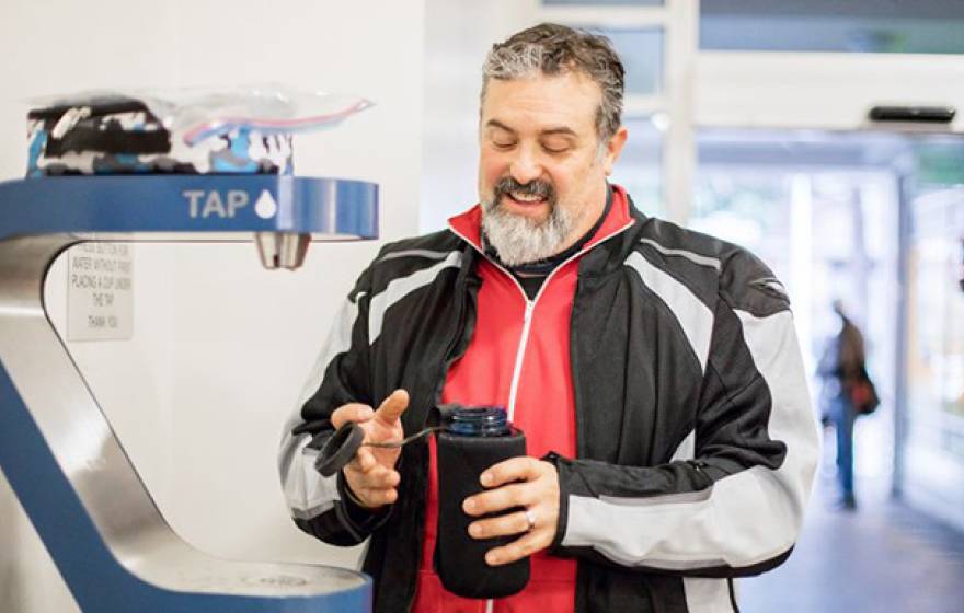 Dave Lieberman, a field mechanic at Scoot Networks, fills his water bottle at a water bottle refilling station in Millberry Union on UCSF’s Parnassus campus.