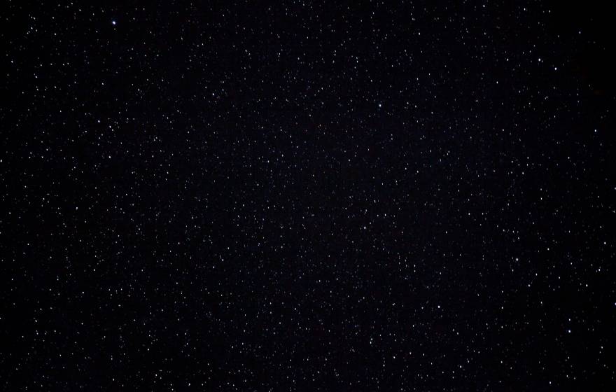 A dark, starry night sky