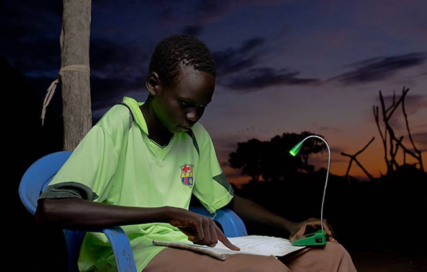 student and solar-powered light