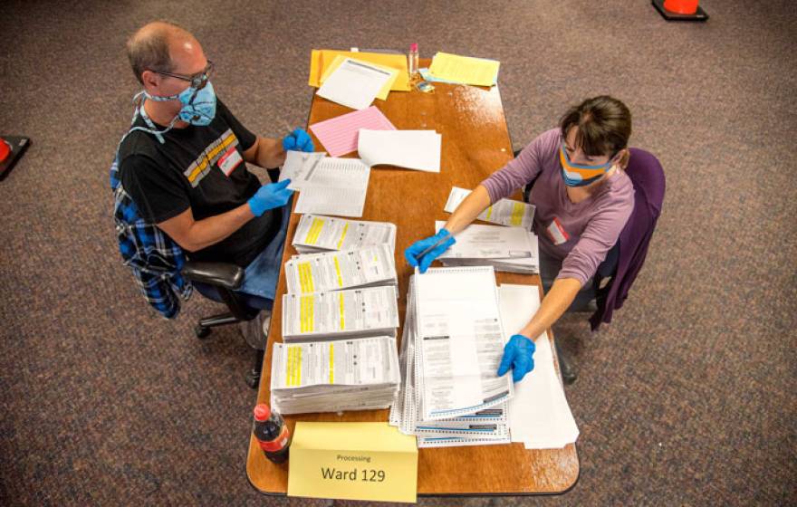 Election workers processing ballots