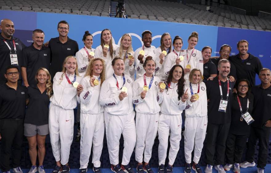 The U.S. women's water polo team poses with their gold medals in Tokyo