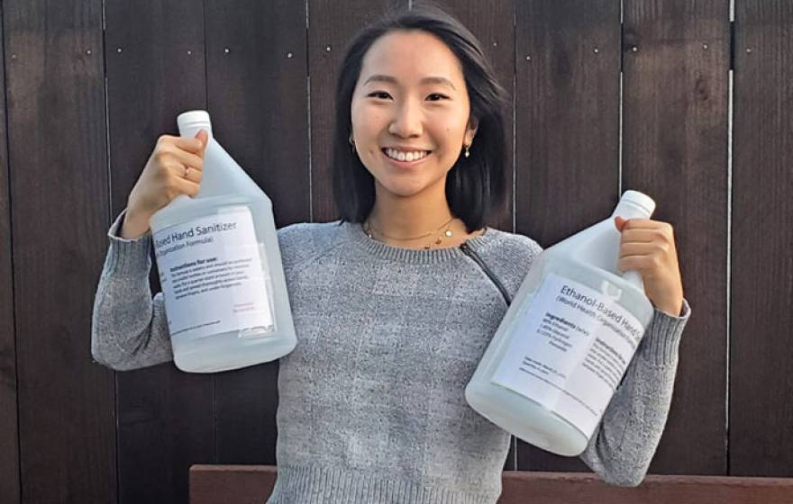Yvonne Hao with the hand sanitizer she helped produce