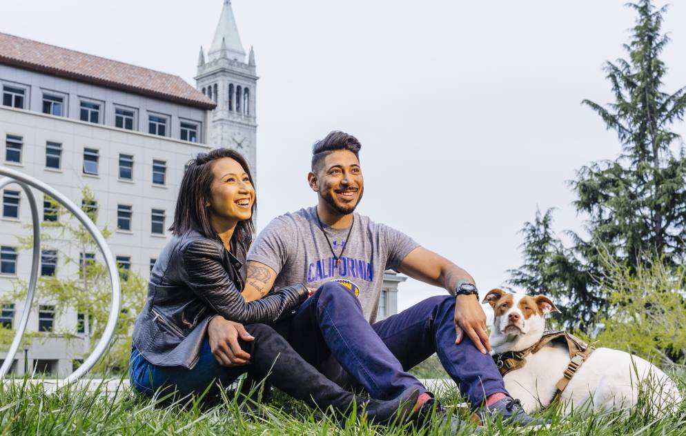 Brian and Monica Vargas with their dog in front of Berkeley's Hearst Mining building.