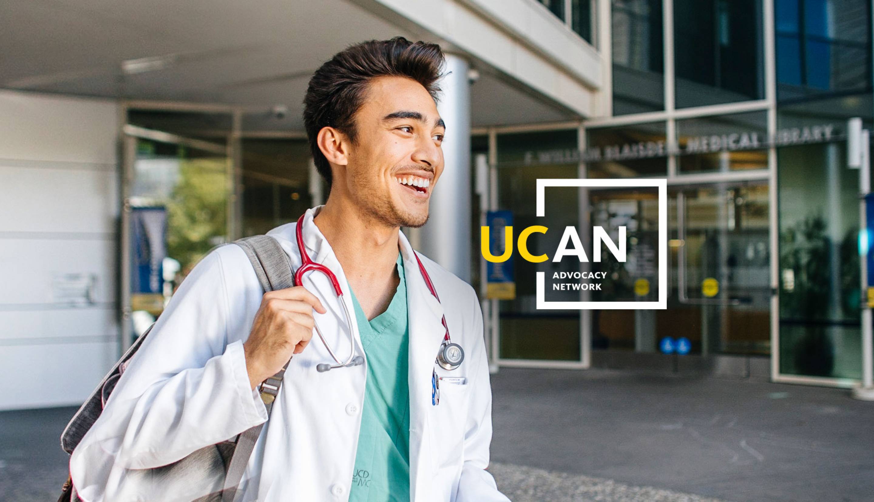 Medical student on campus with the UC Advocacy Network logo.