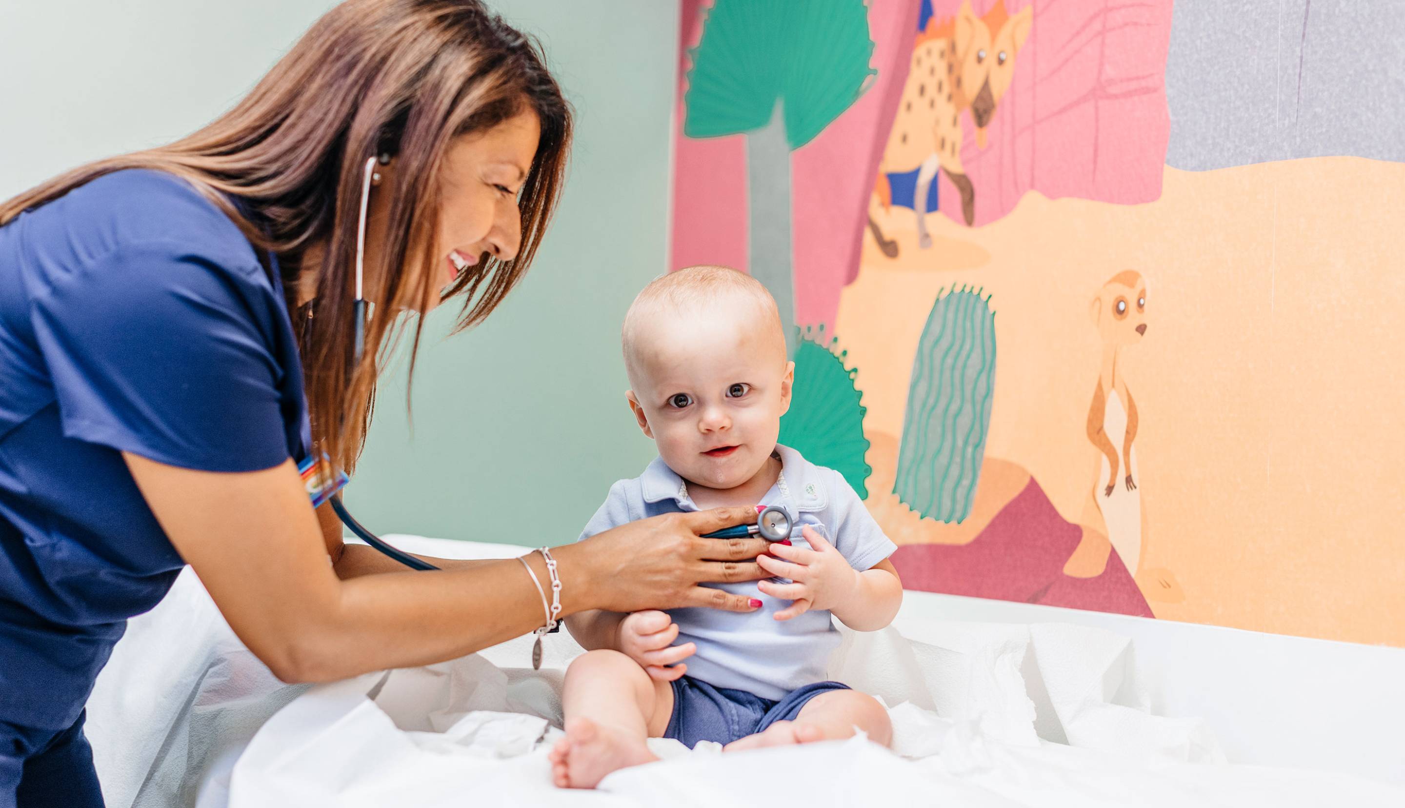 Doctor using a stethoscope on a baby