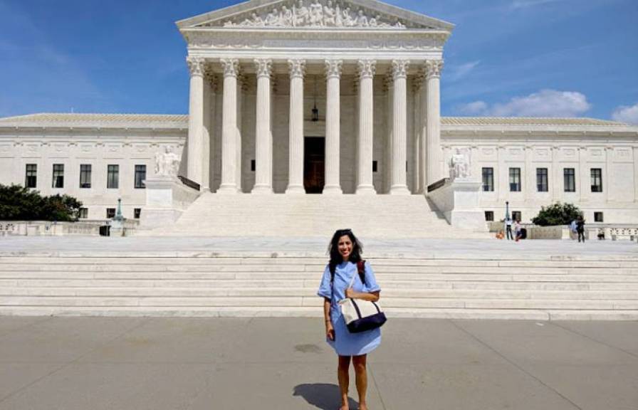 Woman standing in front of the capital building in DC