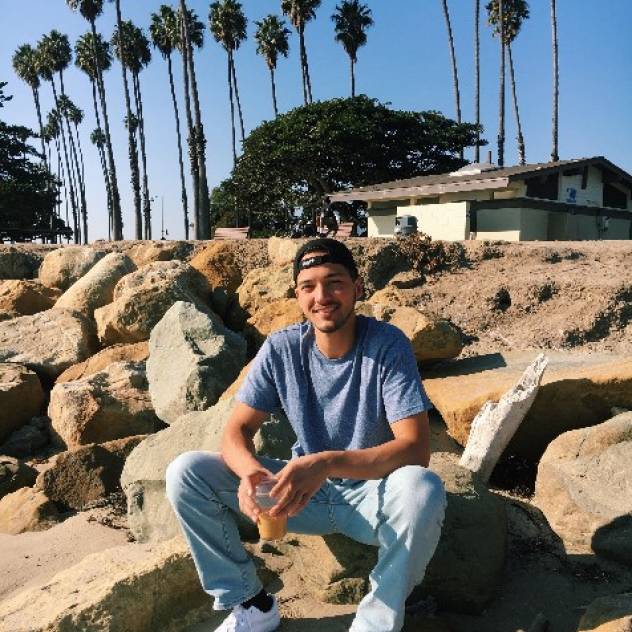 Jonathan Ibarra outside under palm trees