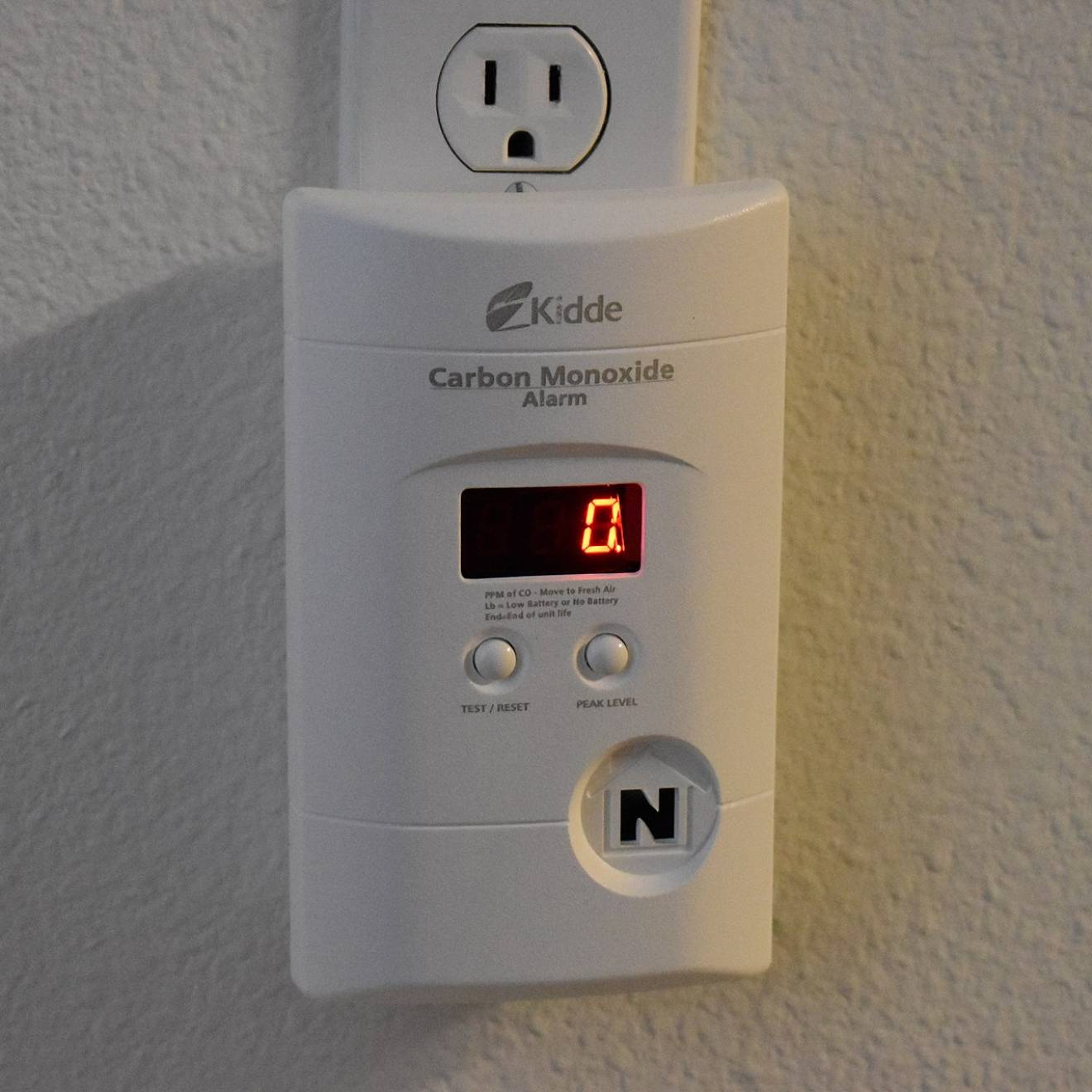 Carbon monoxide detector plugged into a wall outlet