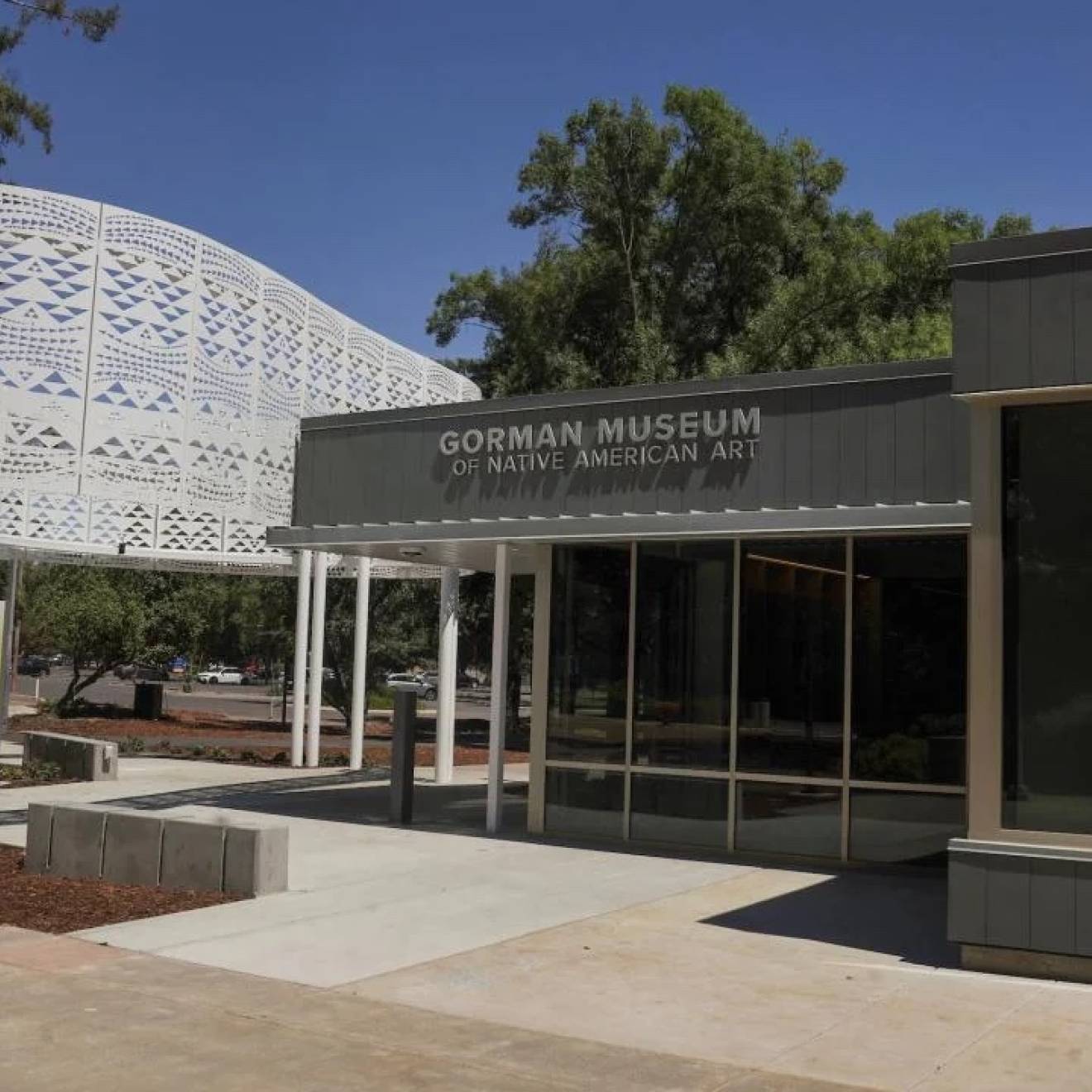 Entrance to the Gorman Museum, a white steel structure and one-story glass and concrete front