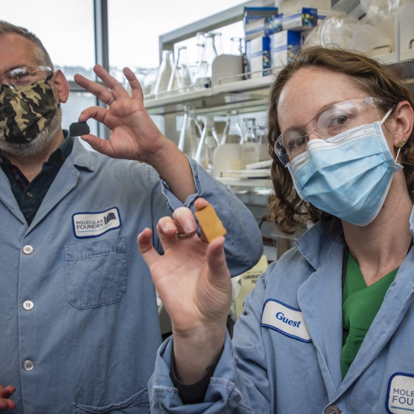 Berkeley Lab scientists Brett Helms and Corinne Scown hold samples of PDK plastic, a unique new material that can be recycled indefinitely