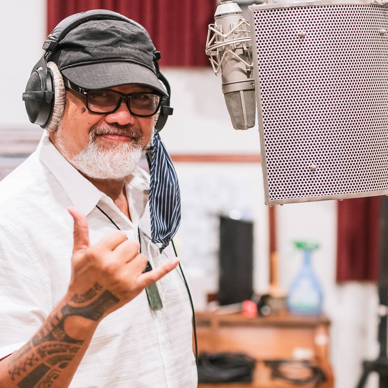 Bruddah Waltah flashes a shaka in a recording studio