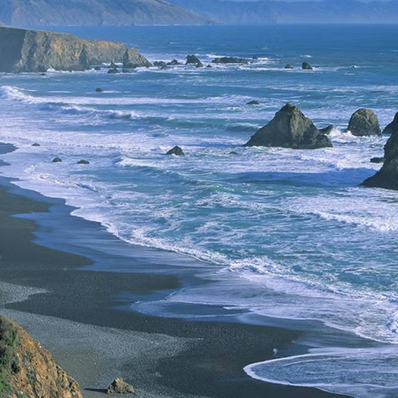 View of the California coast with large rocks in the waves