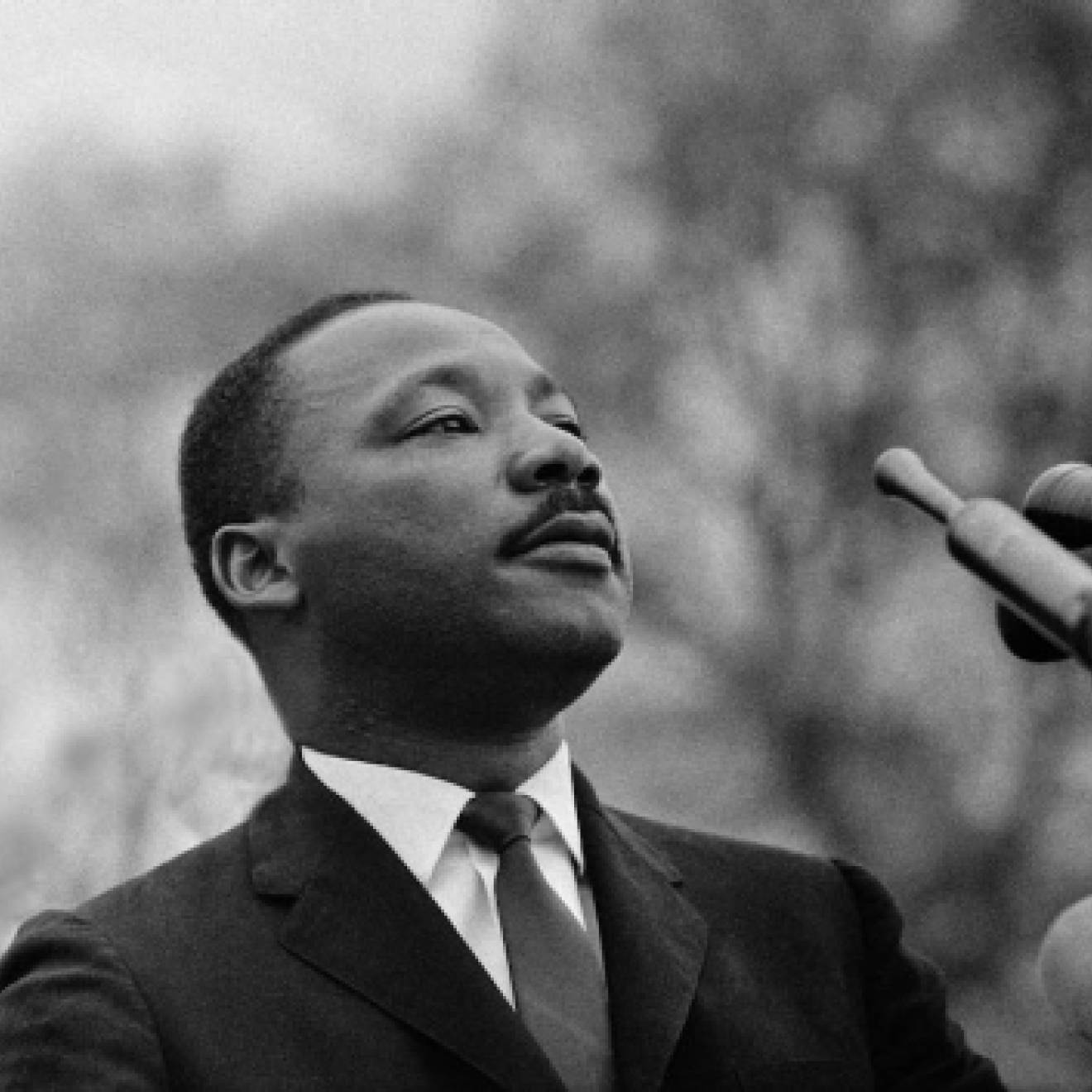 Martin Luther King Jr. at a microphone