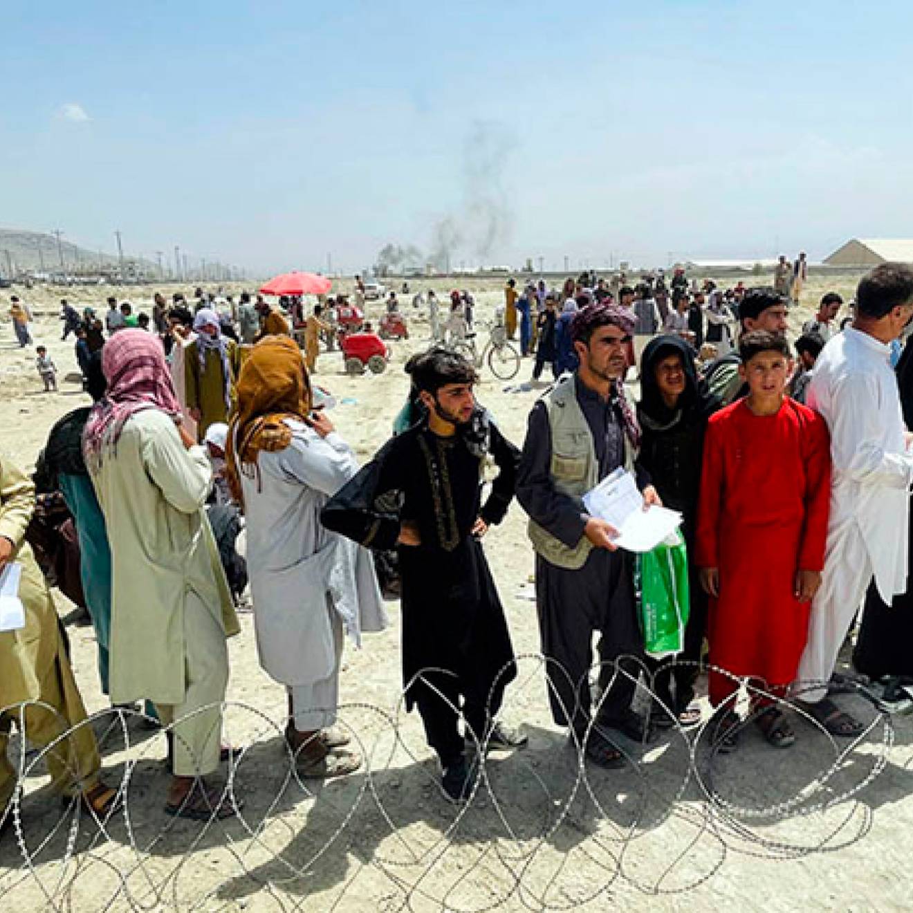 People gathered outside the airport in Kabul