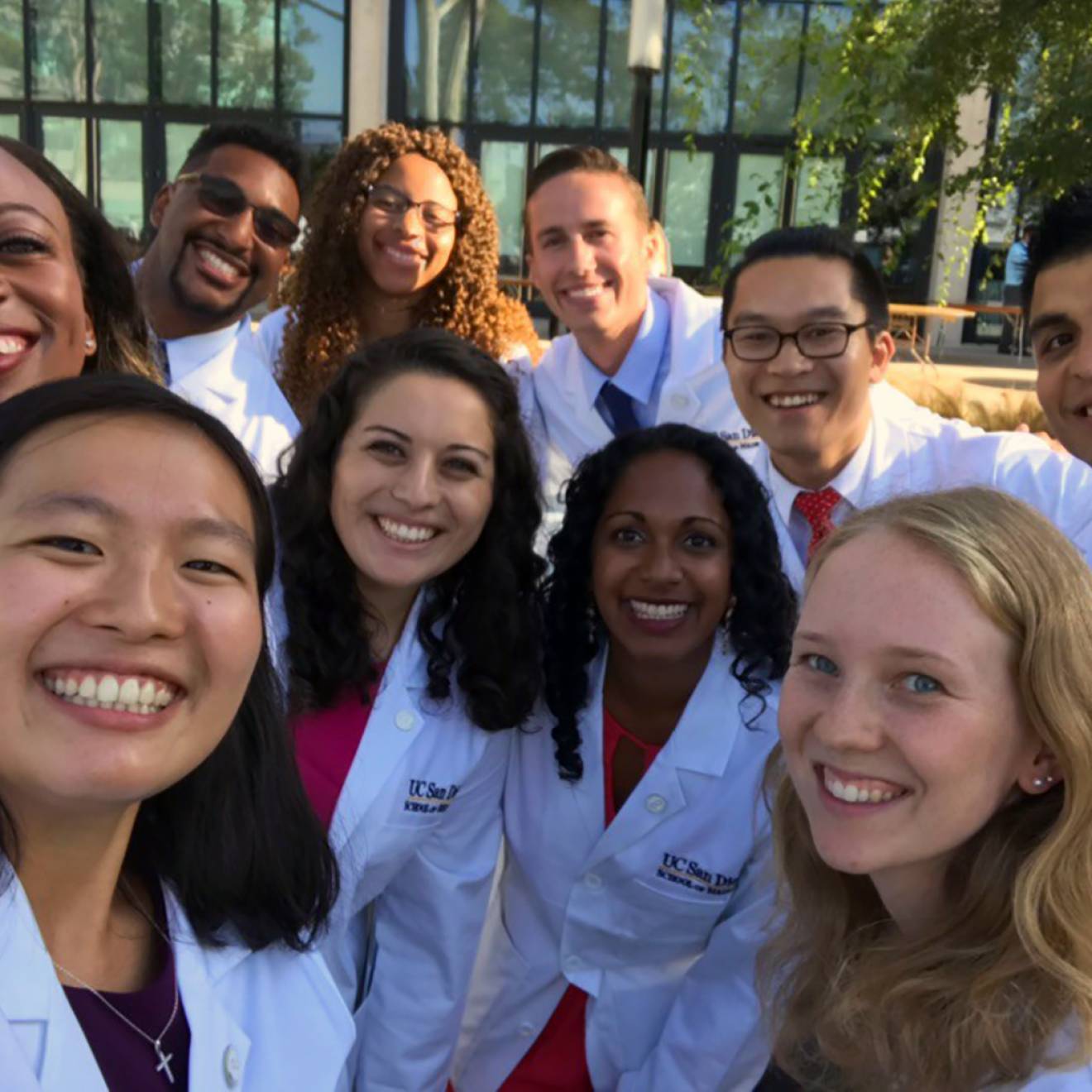 Group selfie of doctors in white coats