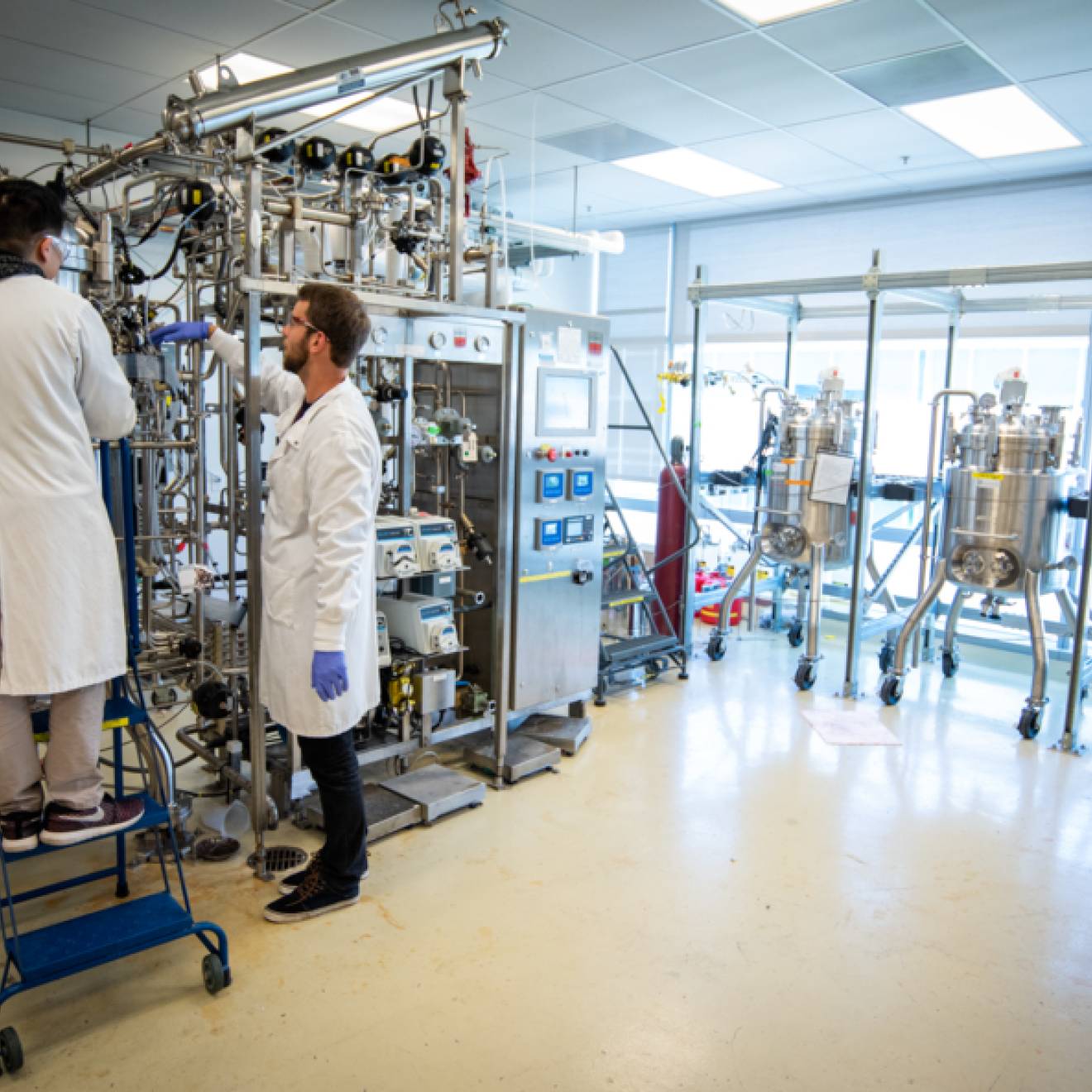 Two people working on a project in a lab