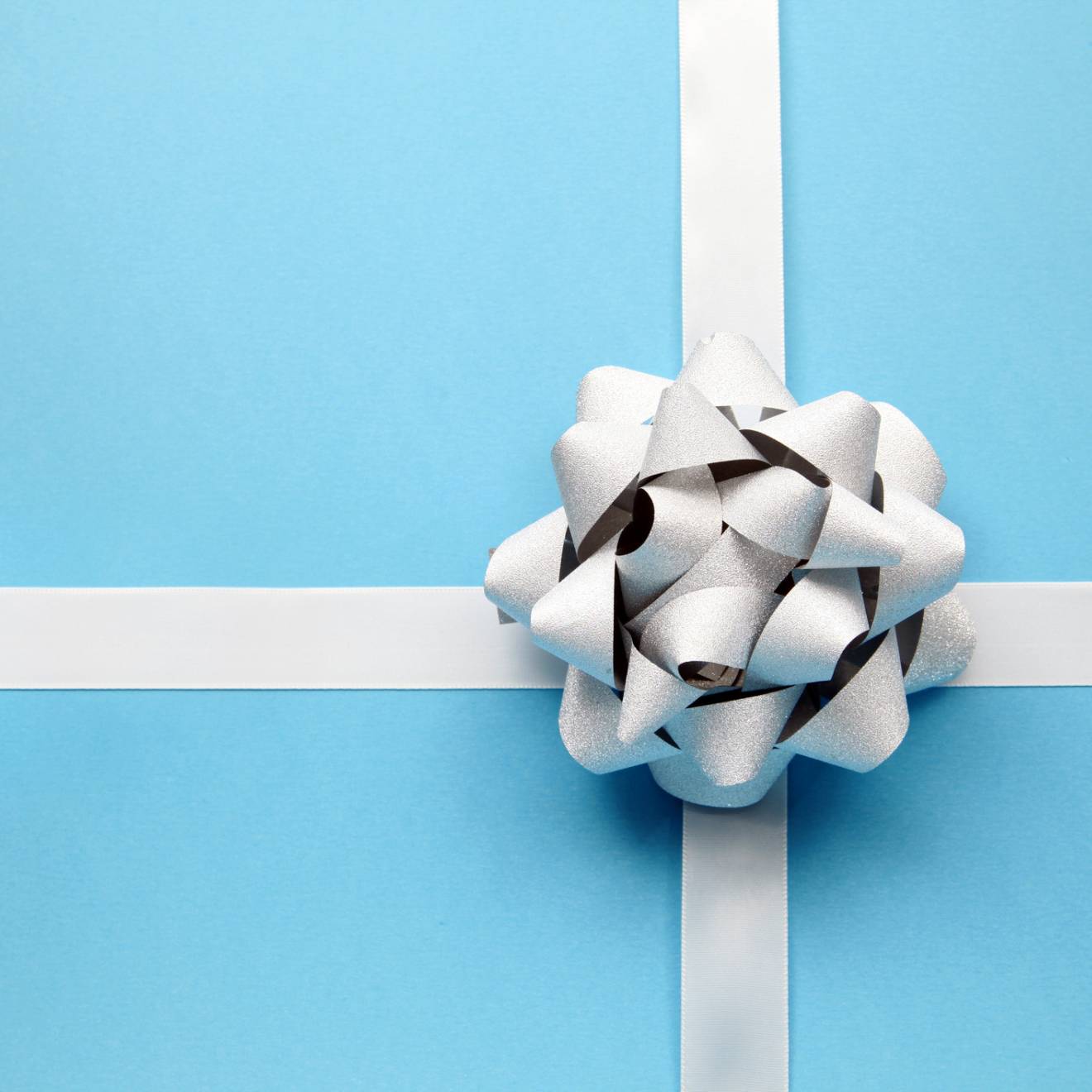 Blue present wrapping with a white bow