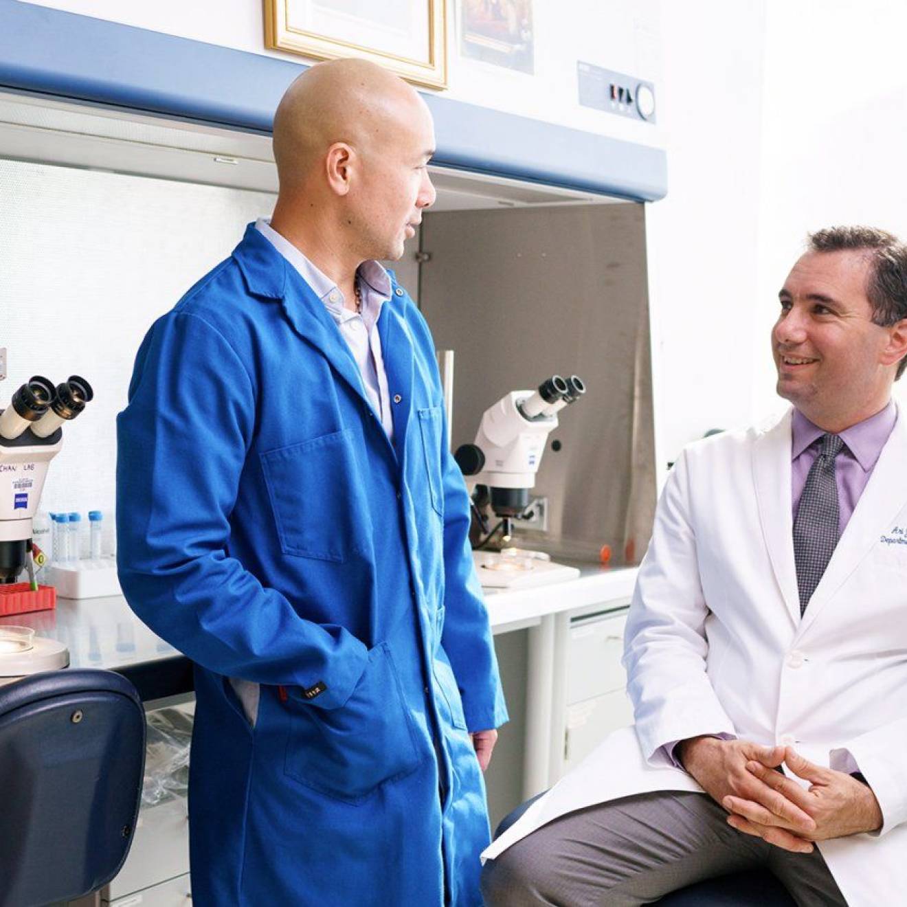 Two doctors talking to each other at UCSF