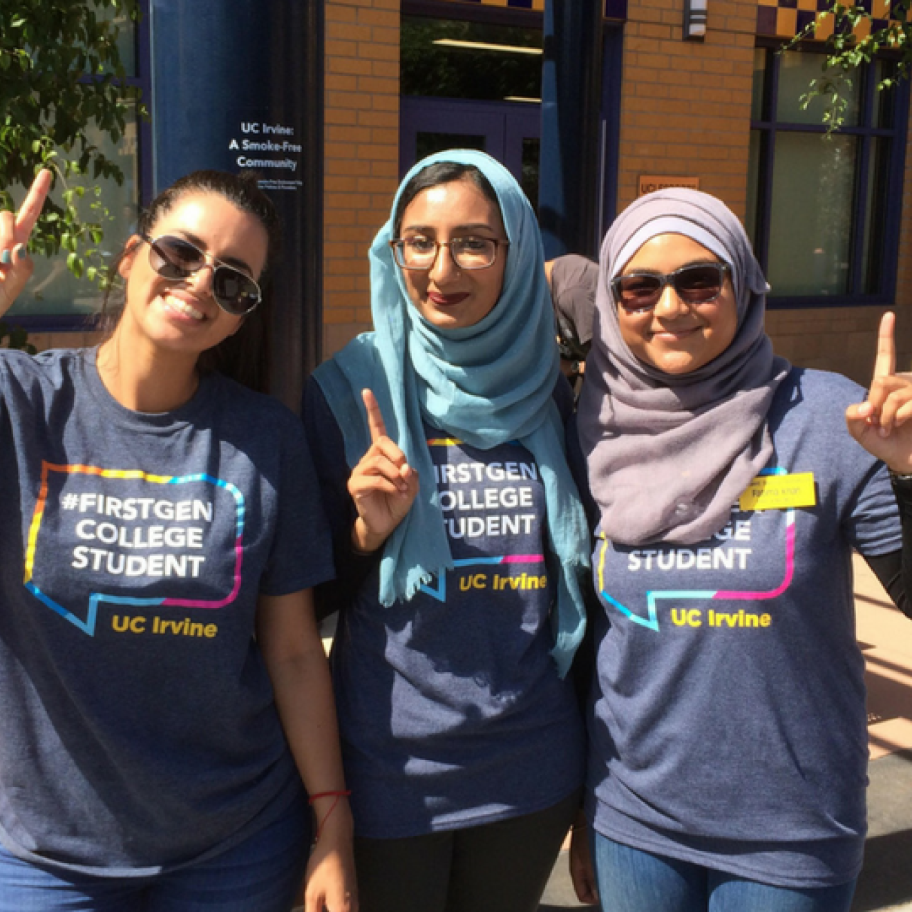 First-gen students pose for picture in first-gen T-shirts