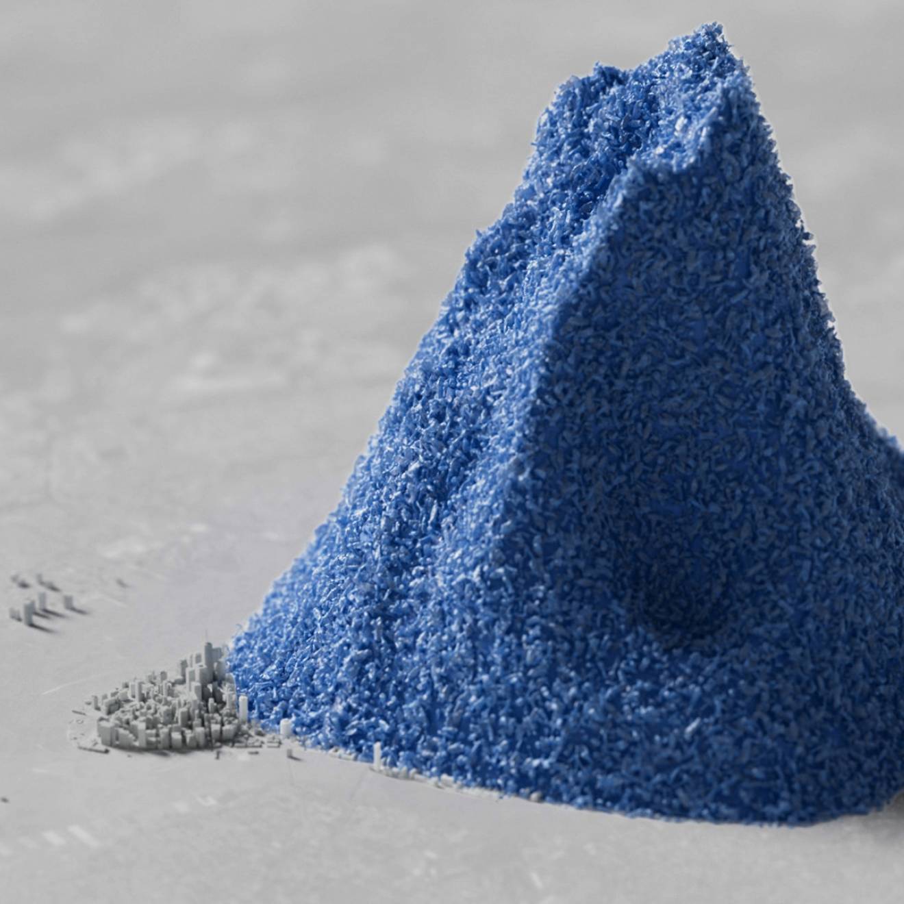 A computer-generated image of a pile of blue plastic beads dwarfing a colorless 3D rendering of Manhattan