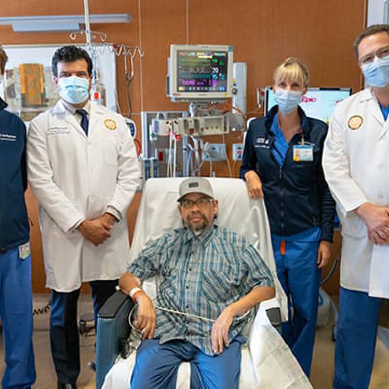 Gomez Gil in hospital with UC San Diego Health team