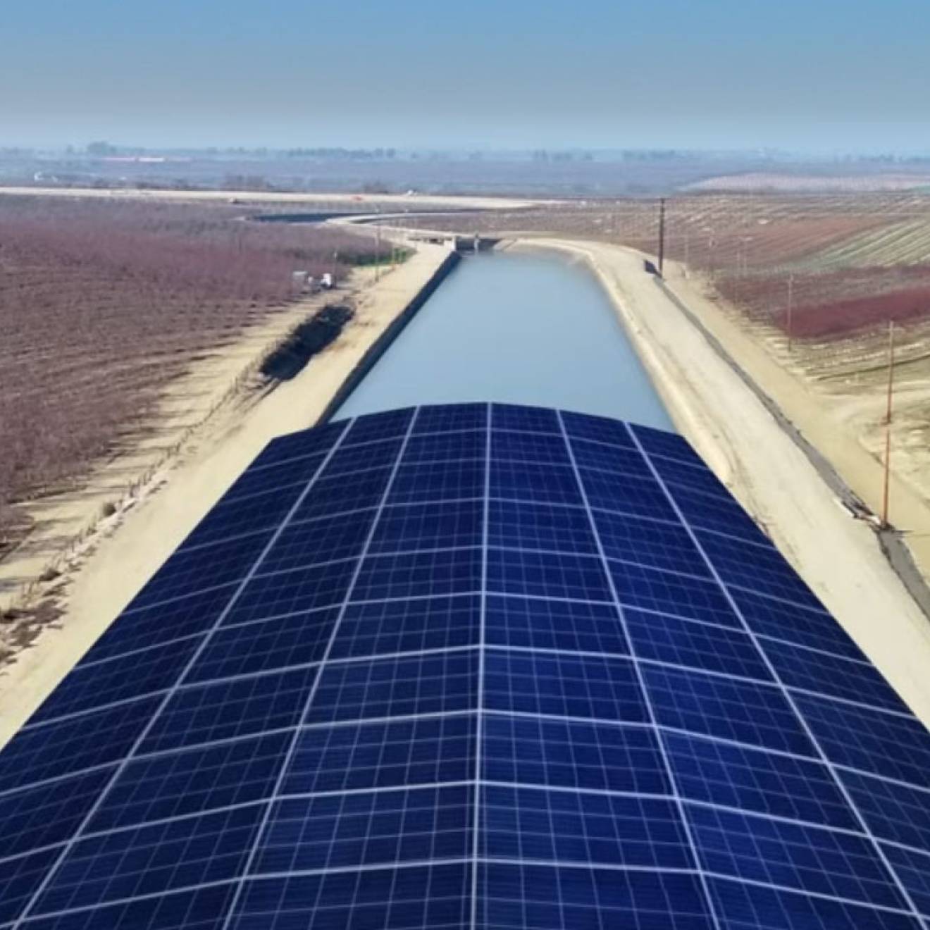 A rendering of solar panels covering an agricultural canal