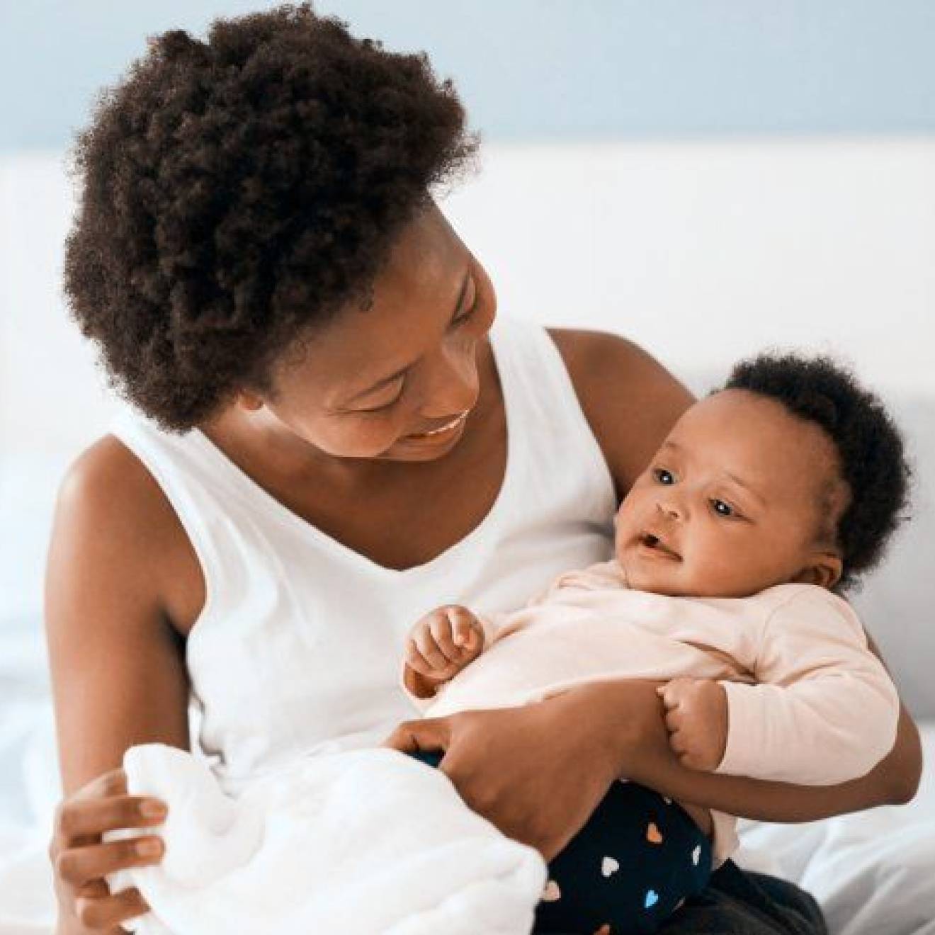 Black mother holding her baby