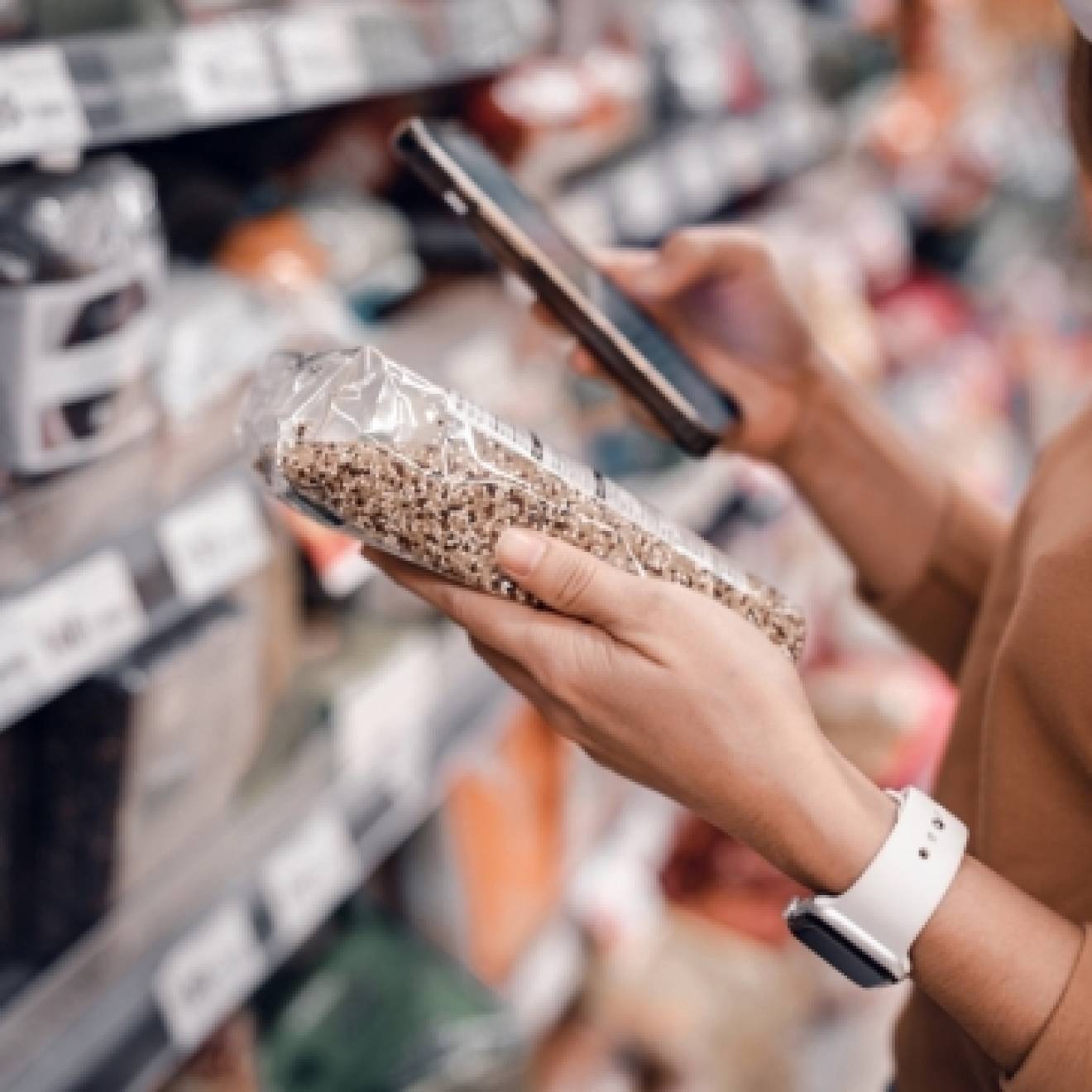 A woman looking at a nutrition label in a store