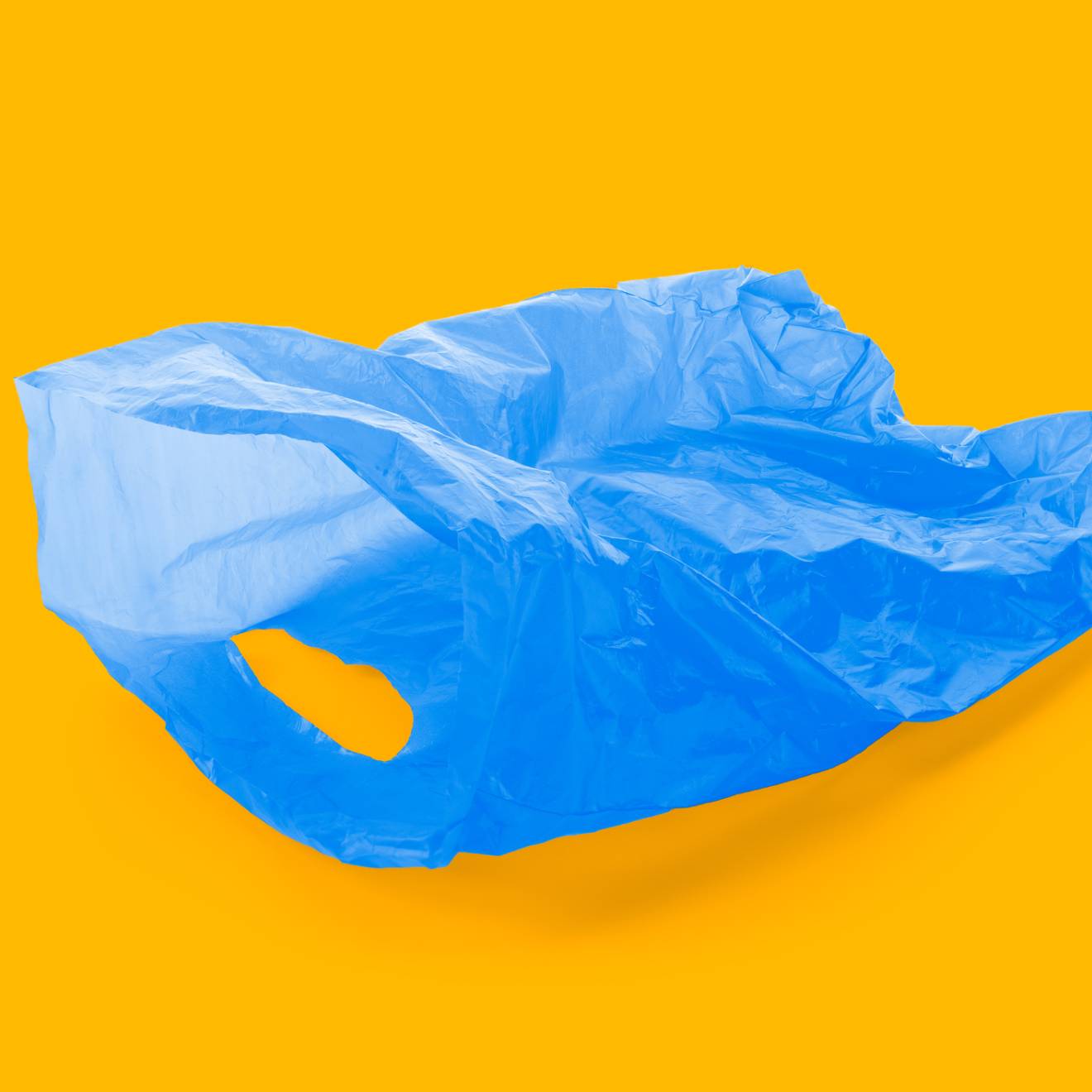 Blue plastic bag on gold background