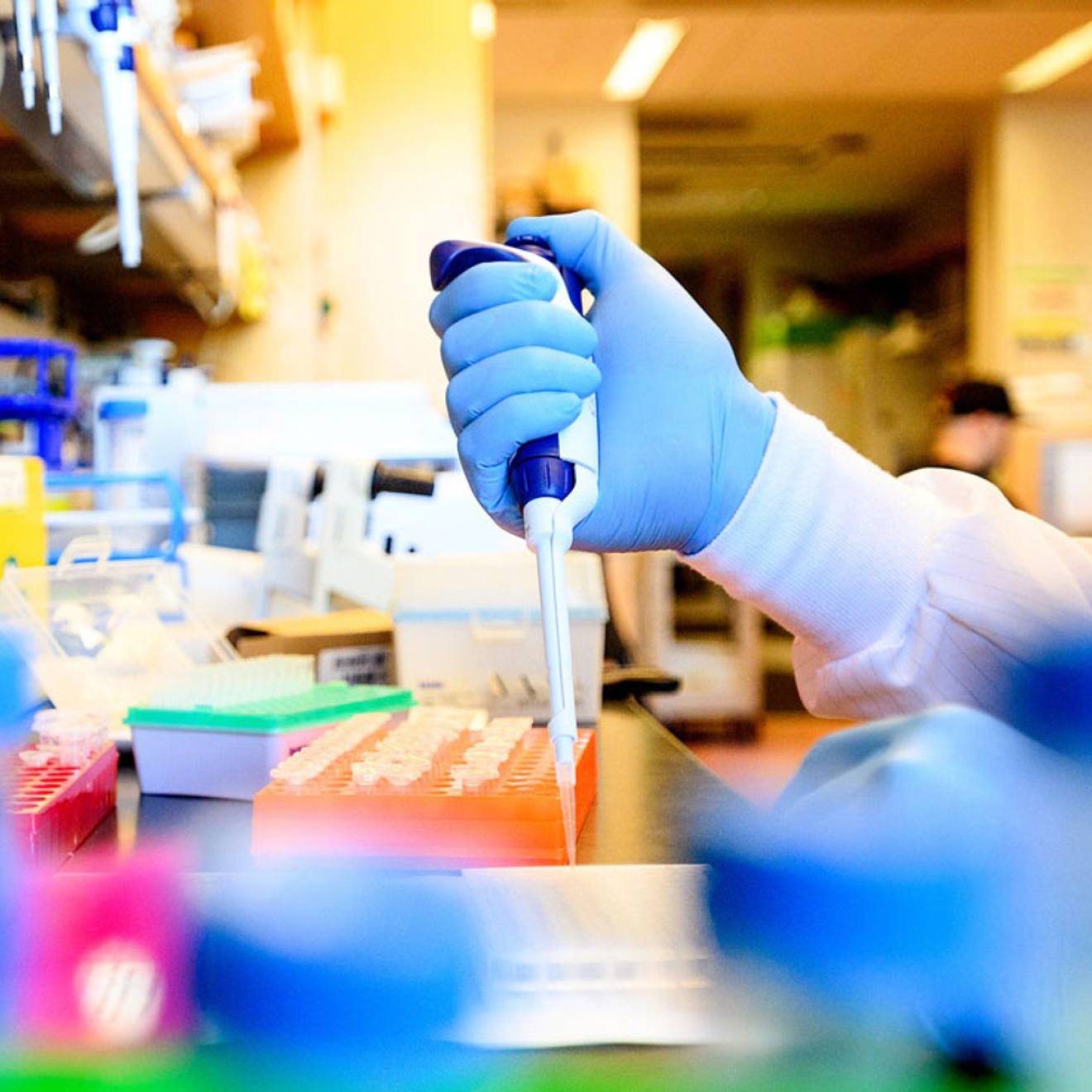Person's hand using equipment in a lab