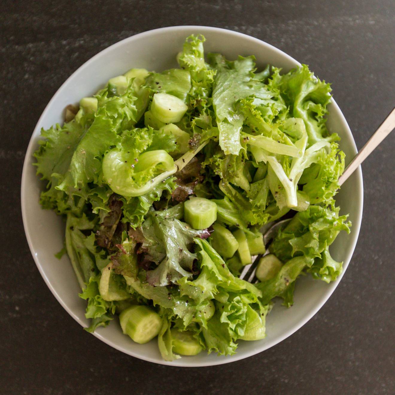 A bowl of salad viewed from overhead