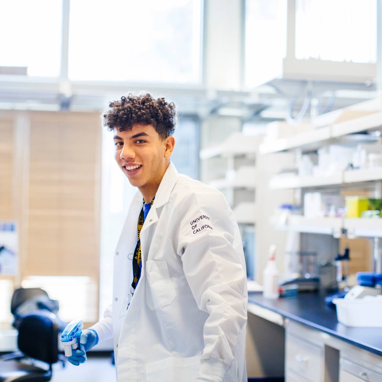 Young Black male researcher in UC lab coat