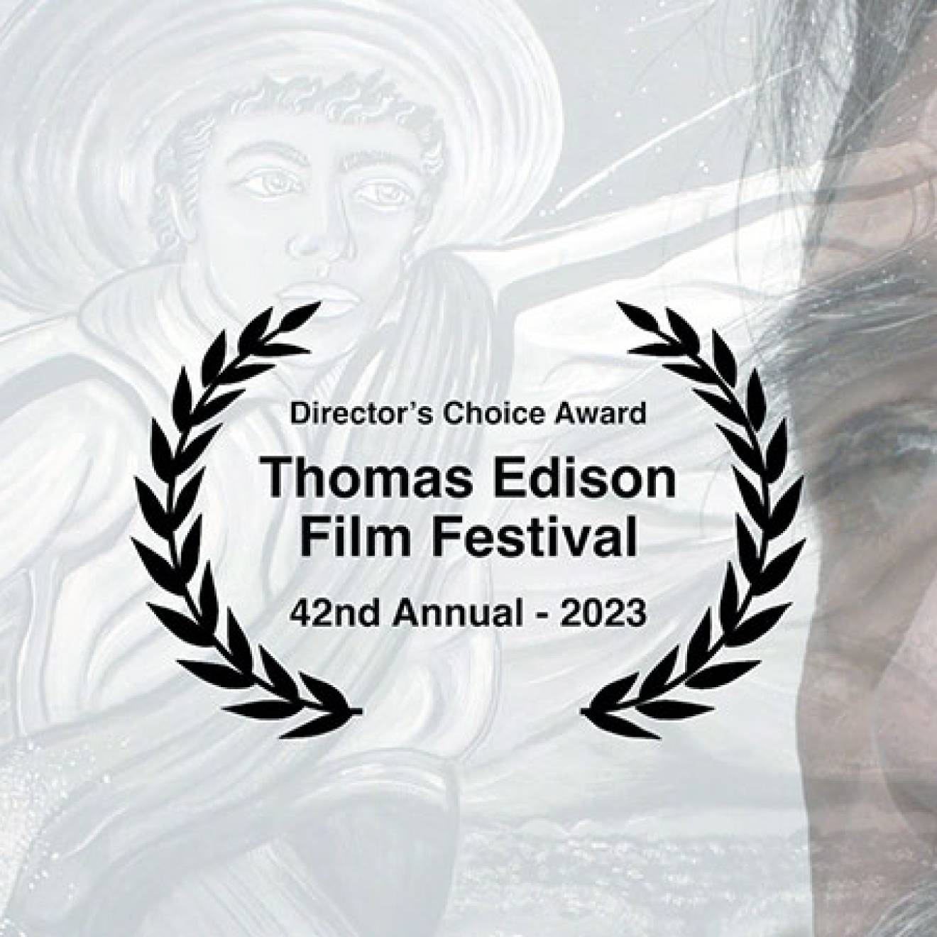 The director's choice award laurels for professor Yehuda Sharim's film "El Ojo," with its subject, Ruben Sanchez, in the background.