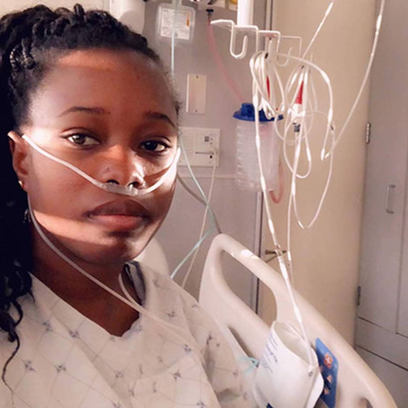 Young Black woman in hospital room