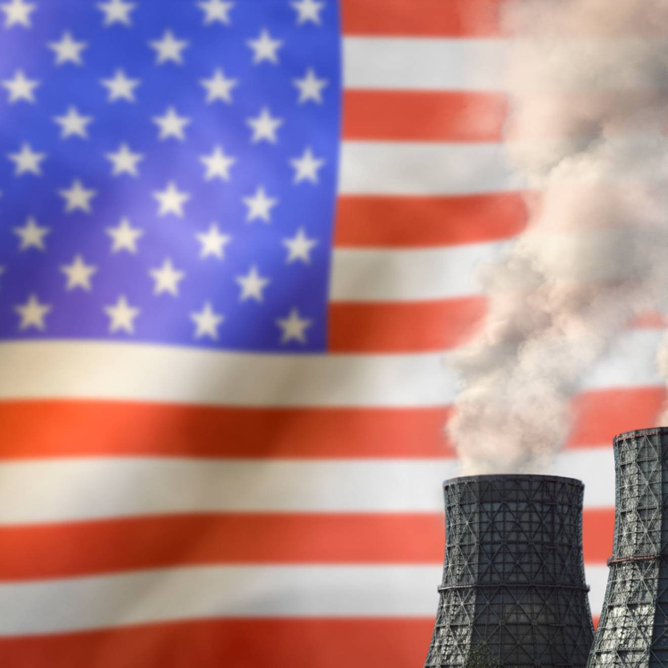 Smokestacks in front of an American flag