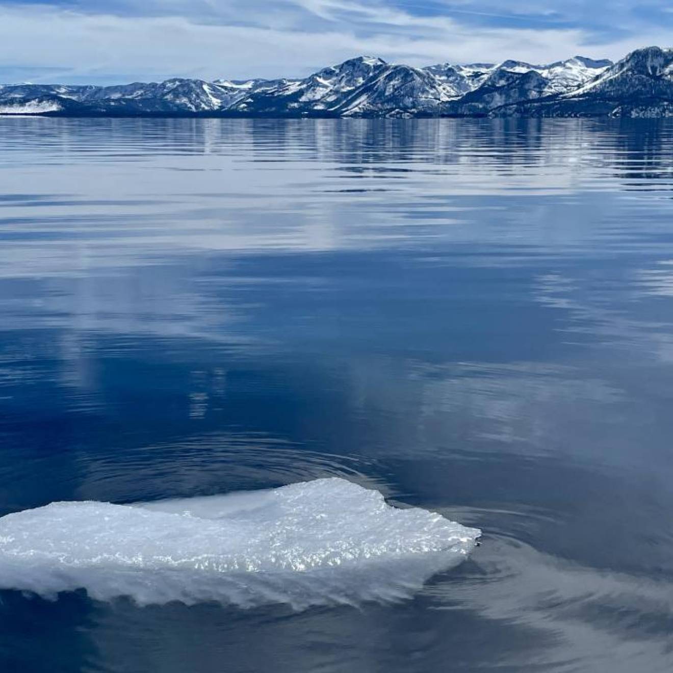 Lake Tahoe in winter with a block of ice in the forefront