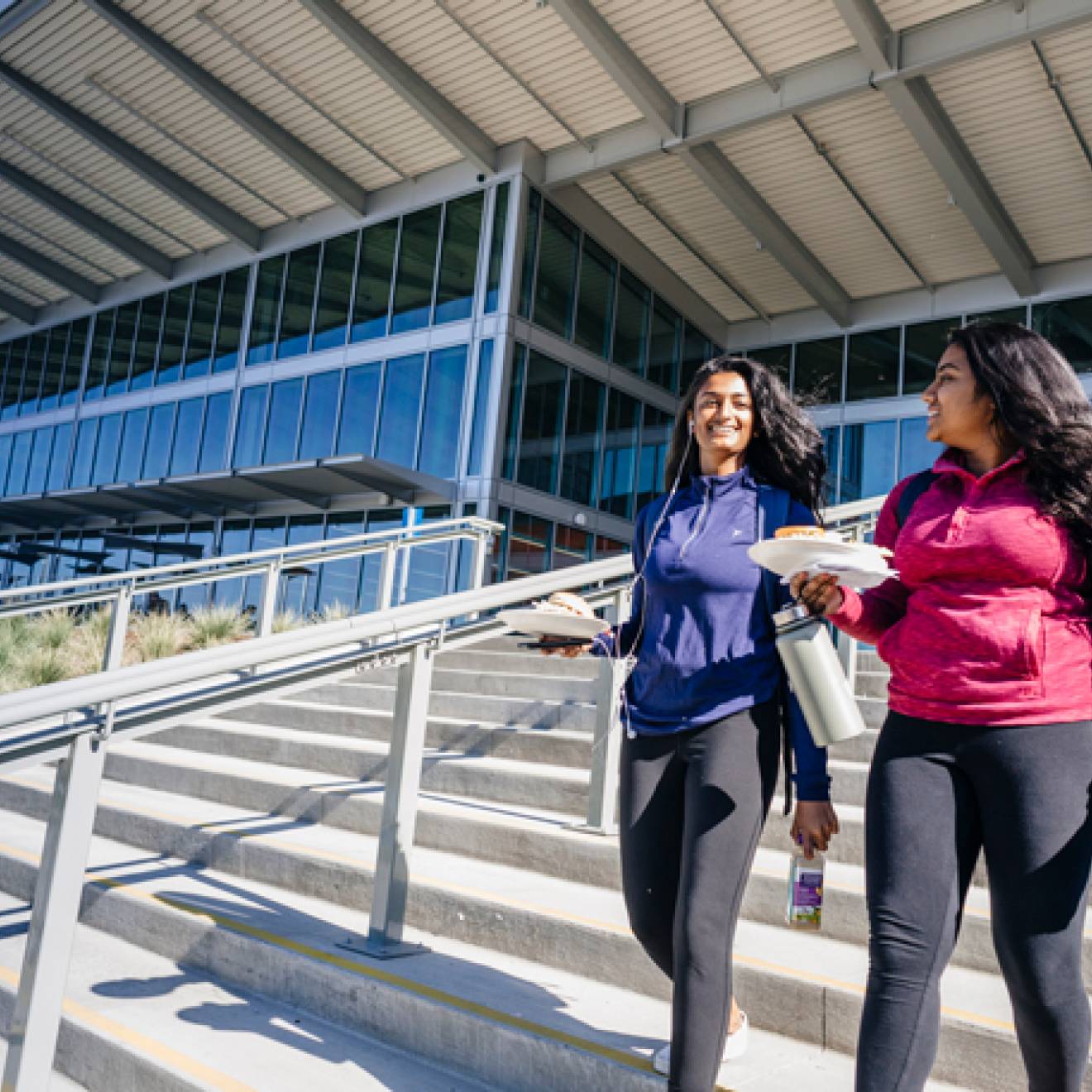 Two students walk out of the Pavilion dining center on the UC Merced campus