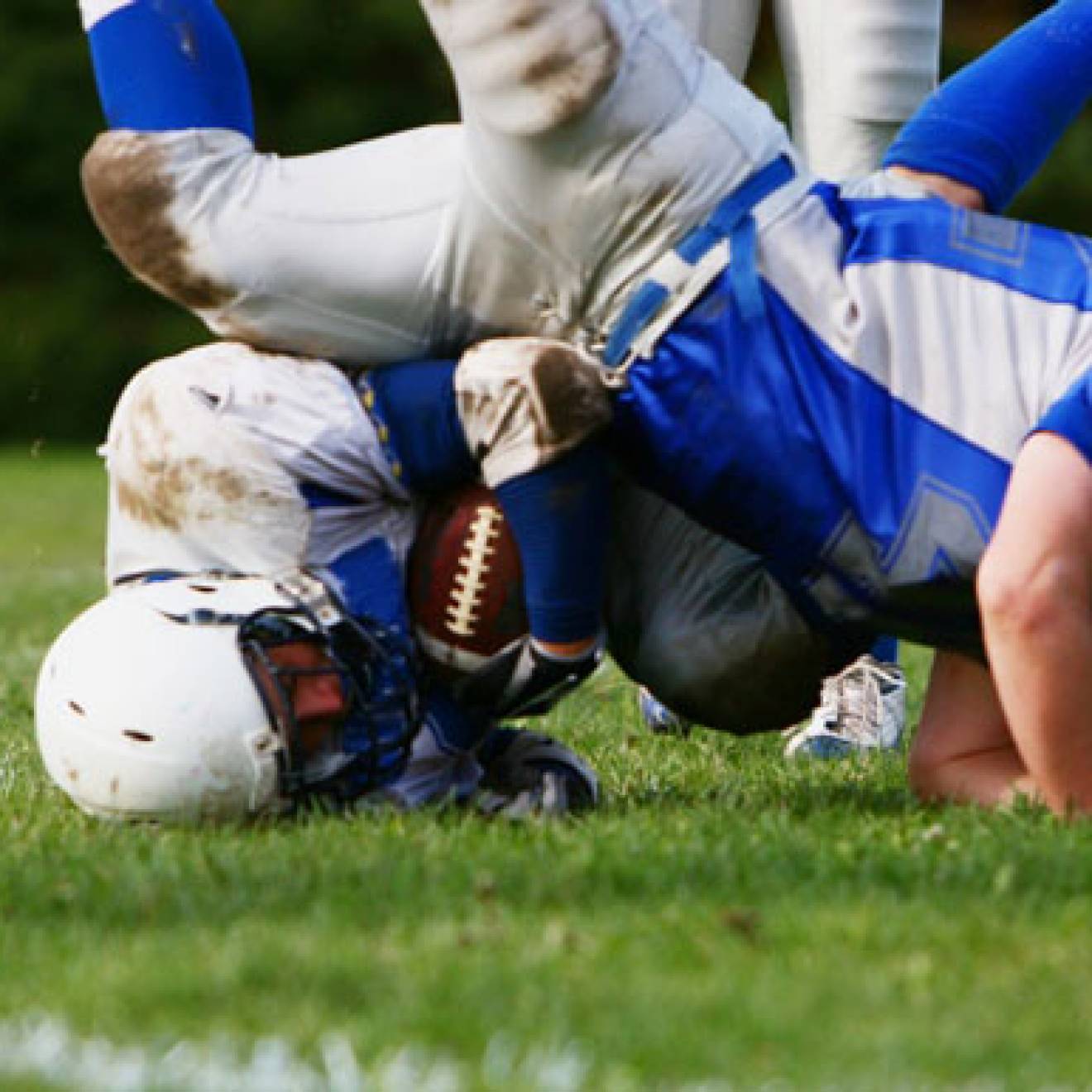 Two boys playing football