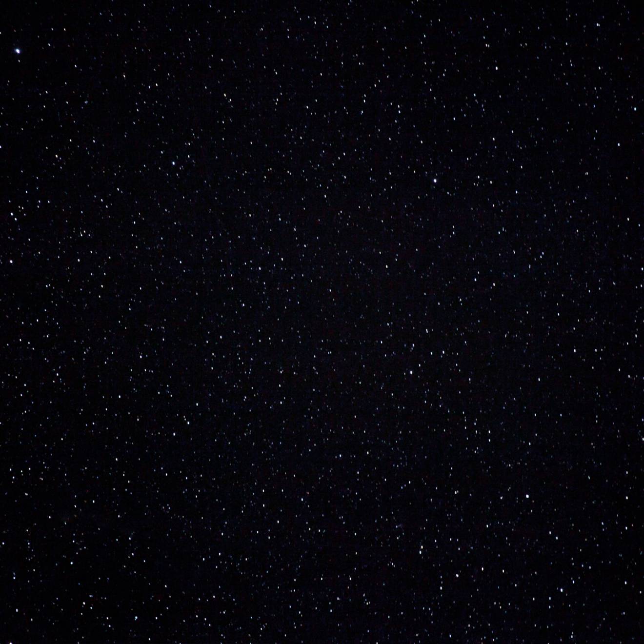 A dark, starry night sky