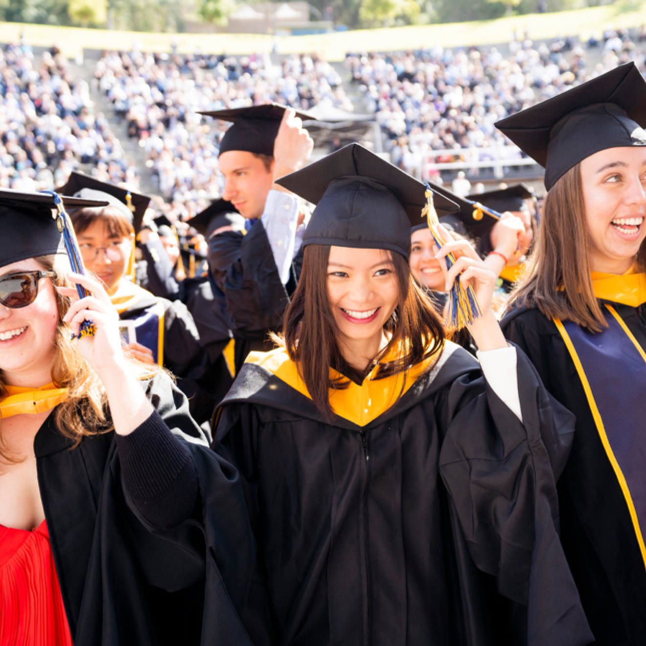 Students at UC Berkeley graduation turn their tassels