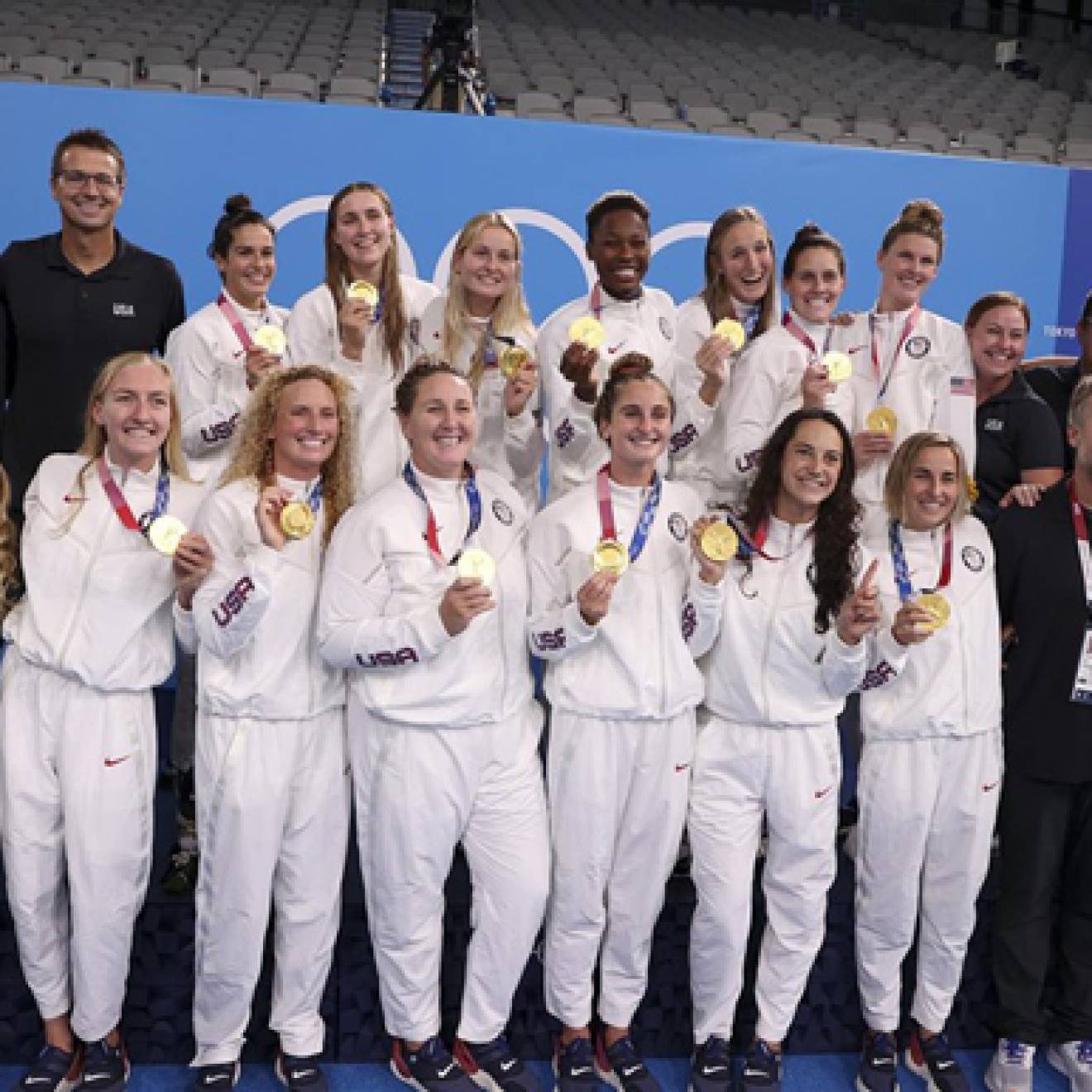 The U.S. women's water polo team poses with their gold medals in Tokyo