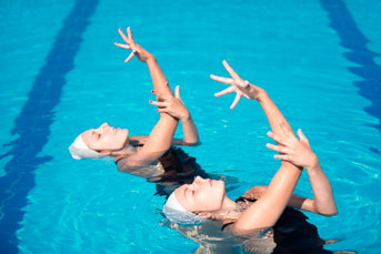 Synchronized swimmers performing